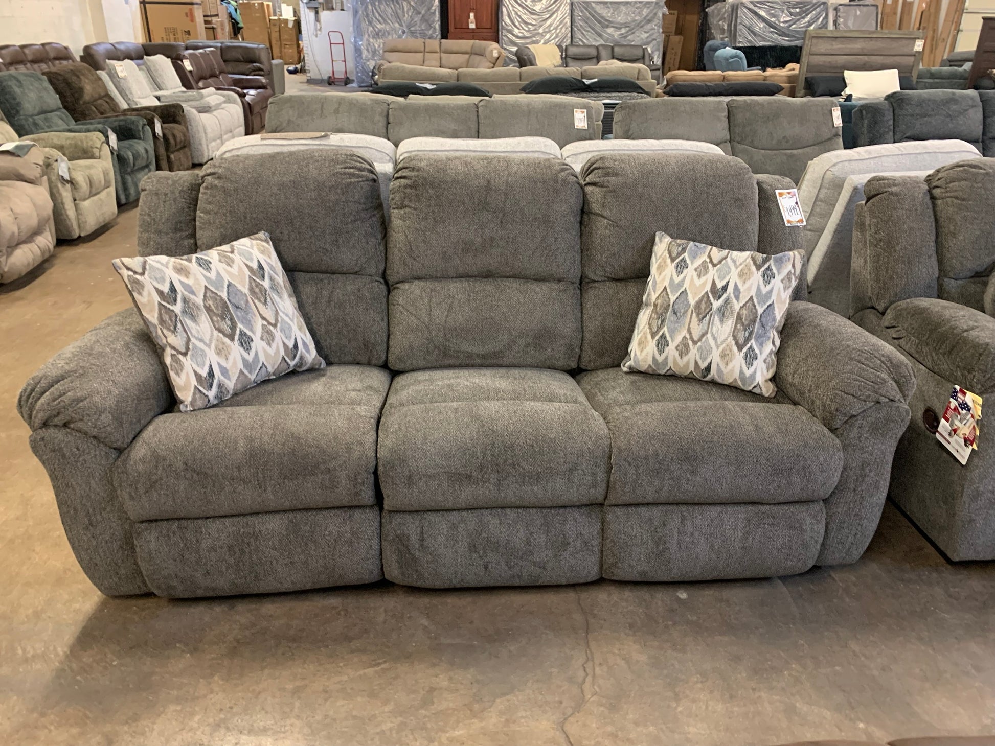 Gray Reclining Sofa with Accent Pillows