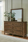 Sturlayne King Upholstered Panel Bed, Dresser, Mirror, Chest and Nightstand